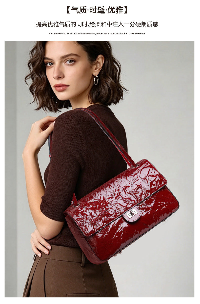 The Statement Flap Bag, worn in wine, close up