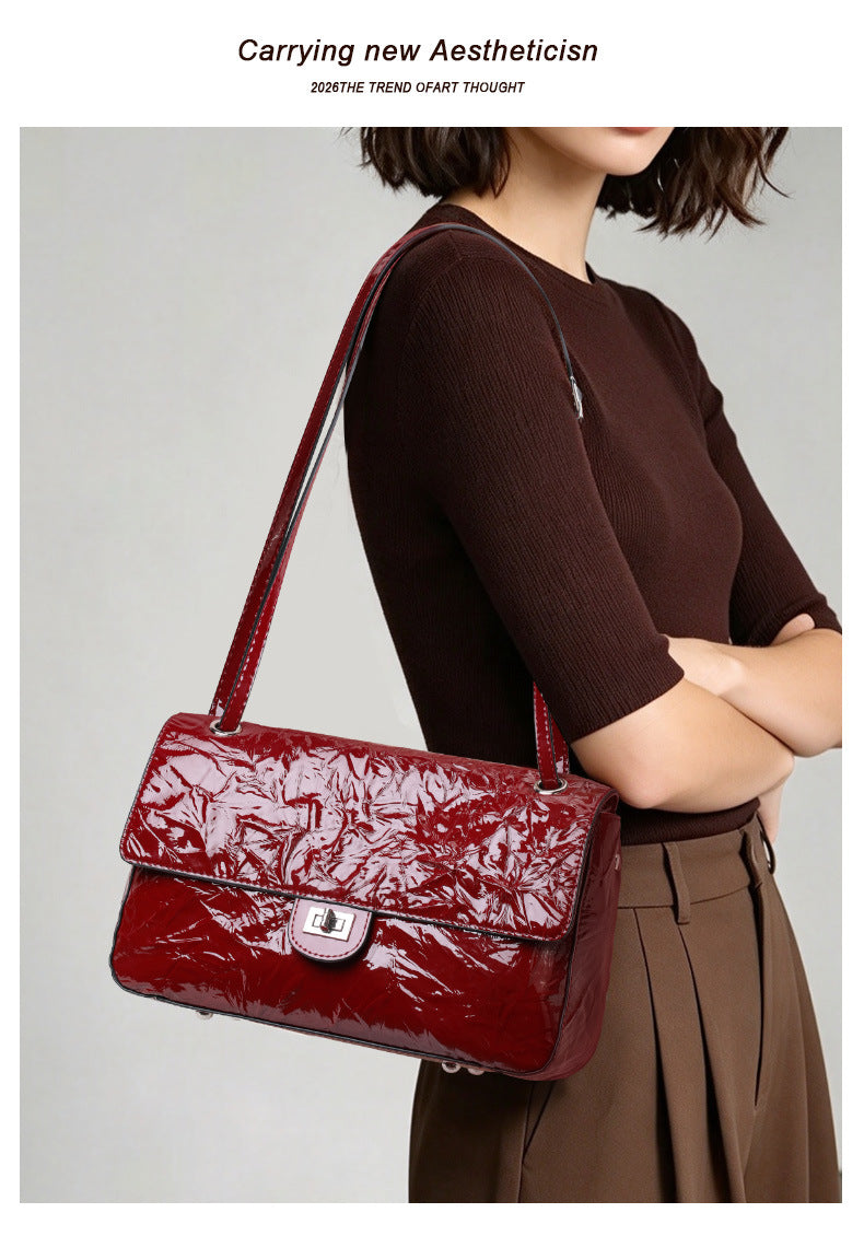 The Statement Flap Bag, front view in wine