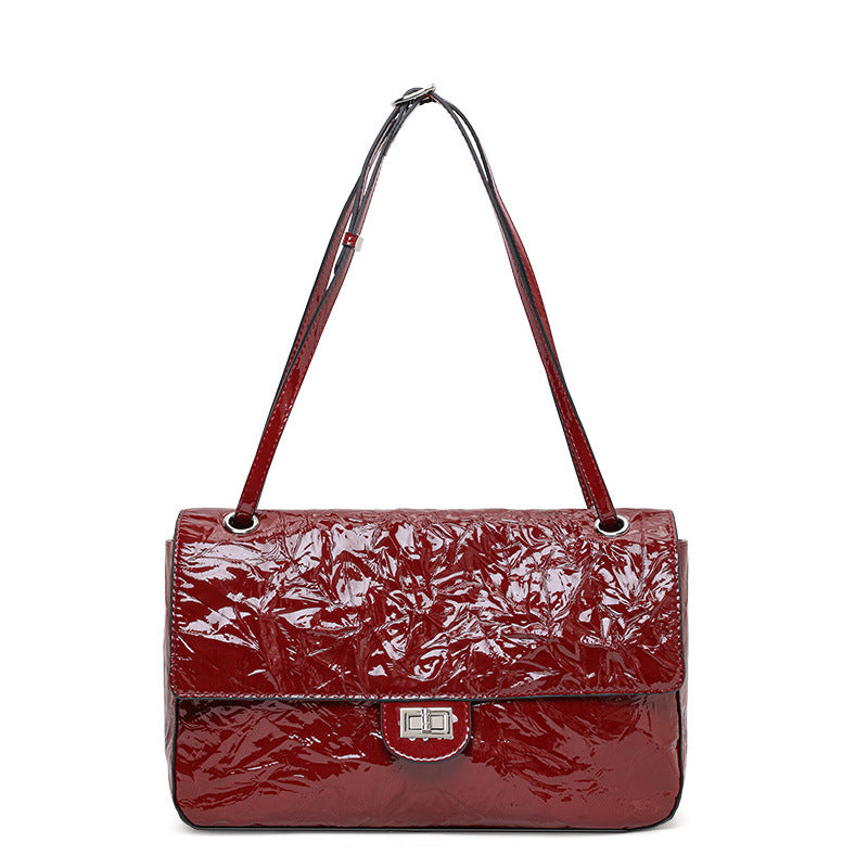 The Statement Flap Bag, showing the short and long straps