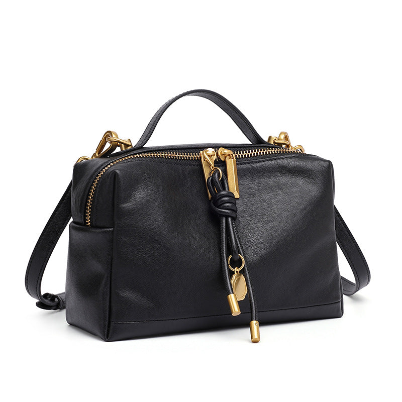 The Top-Handle Bag, front view in black