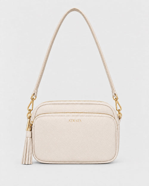 The Elara Crossbody, in stone with gold hardware