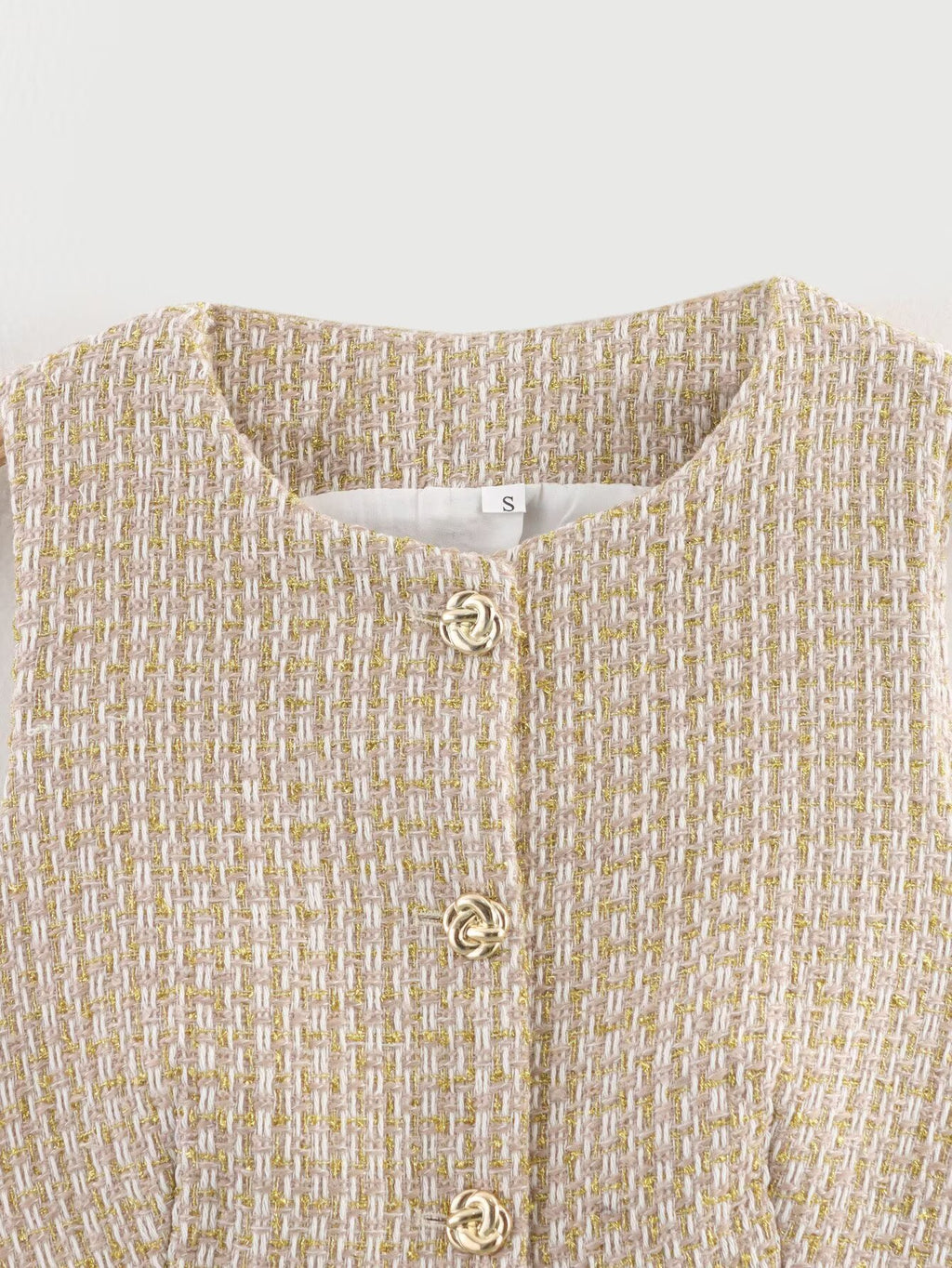 The Gilded Waistcoat, close-up of the tweed and gold buttons