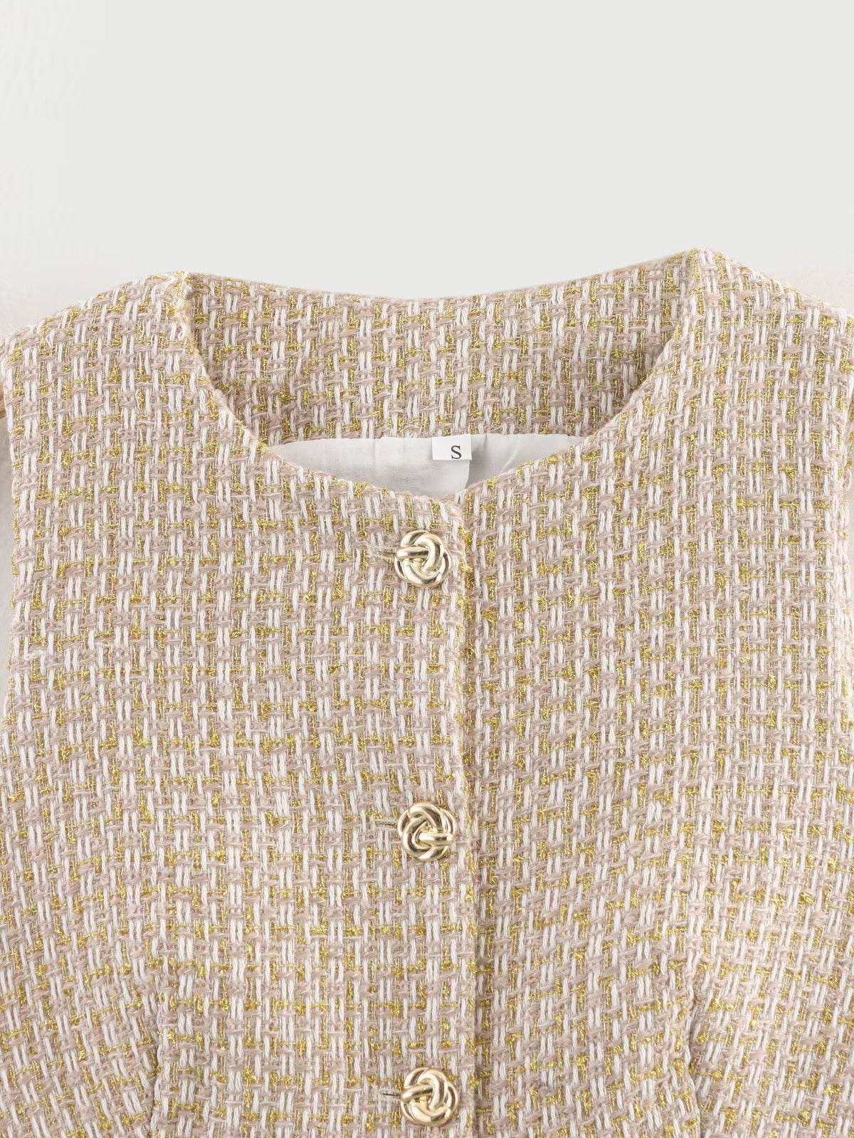 The Gilded Waistcoat, close-up of the tweed and gold buttons