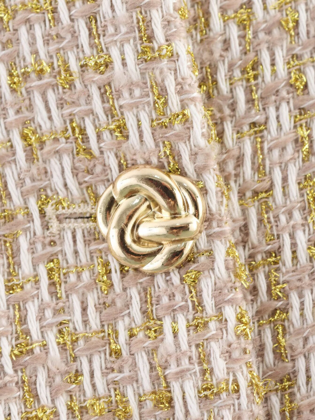 The Gilded Waistcoat, close-up of the gold knot button