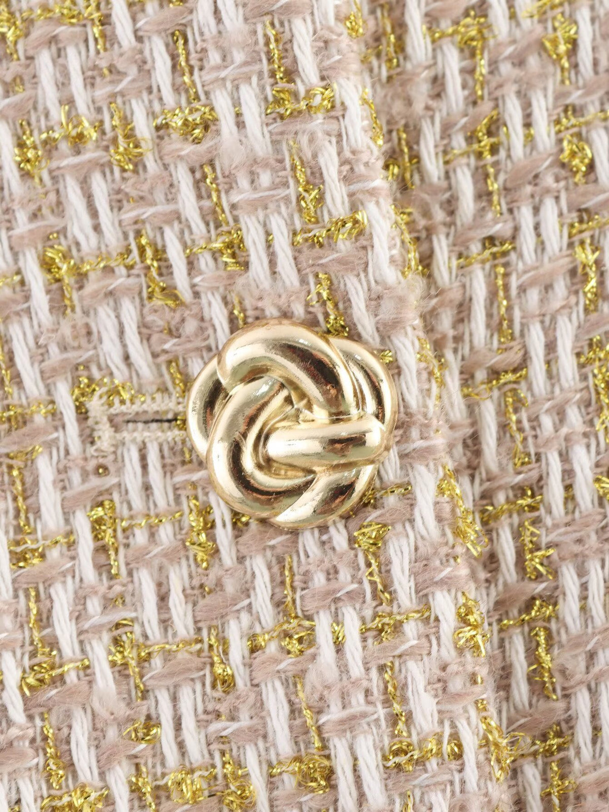 The Gilded Waistcoat, close-up of the gold knot button