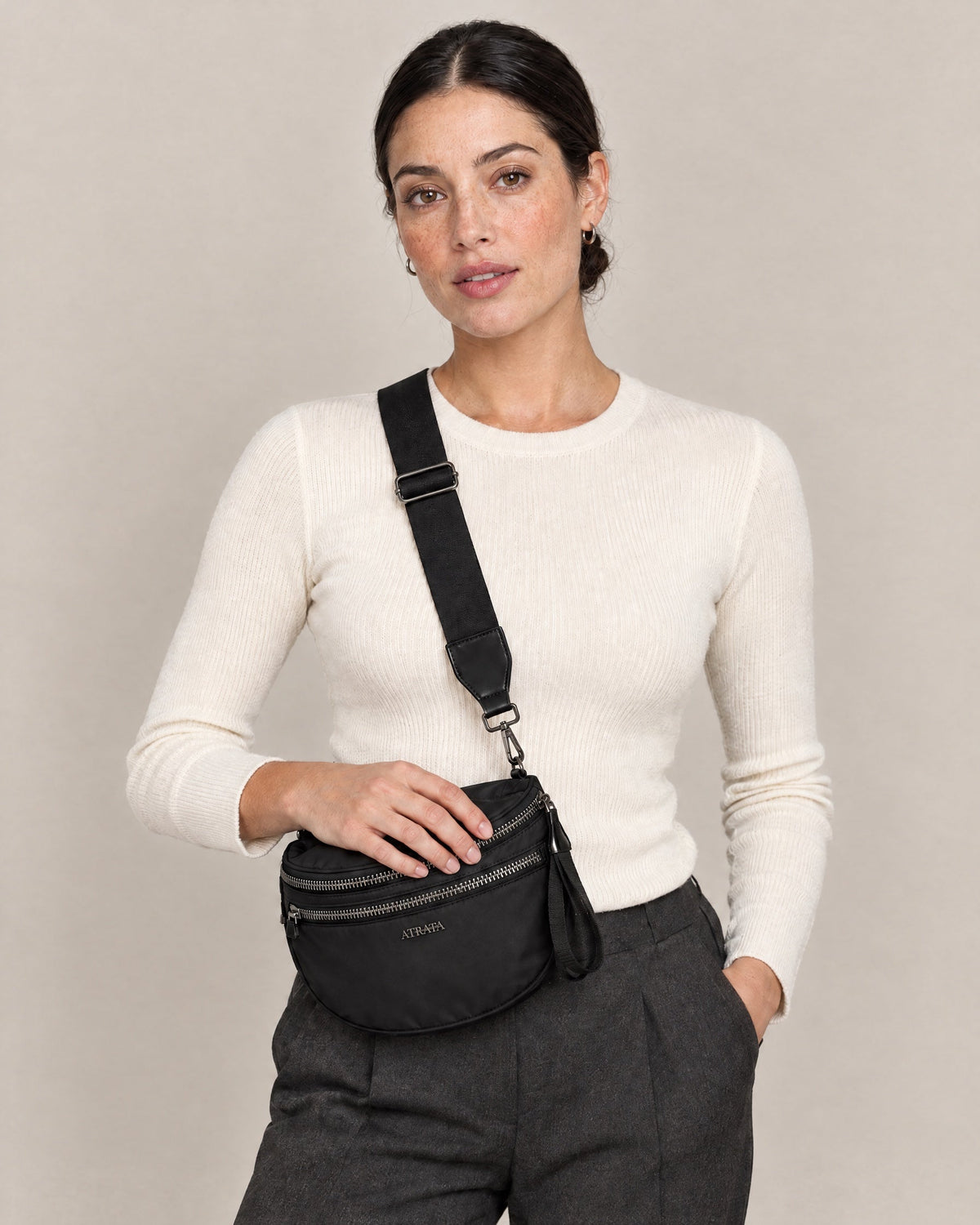 The Kelaino Crossbody, worn across the body
