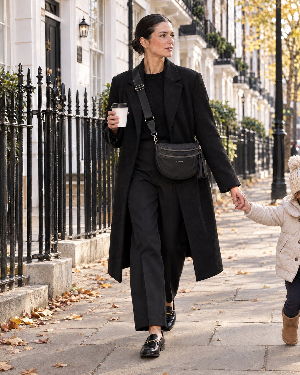 The Kelaino Crossbody, worn hands-free on the street