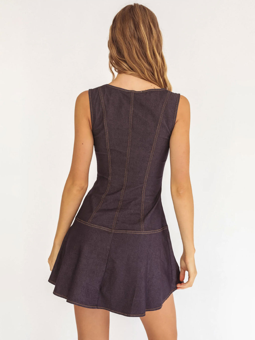 The Lullaby Dress, in indigo denim, back view