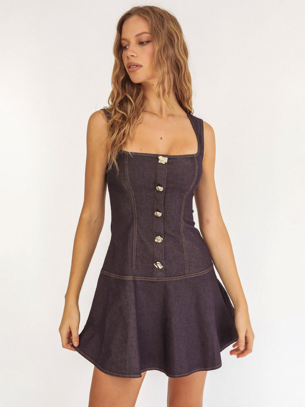 The Lullaby Dress, in indigo denim, three-quarter view