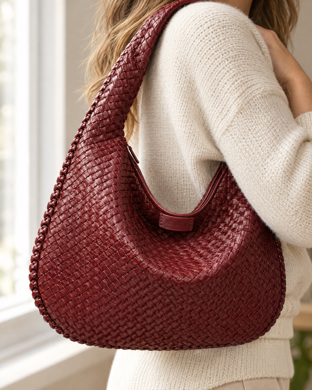 The Ember Bag, close-up of the hand-woven texture and logo tab