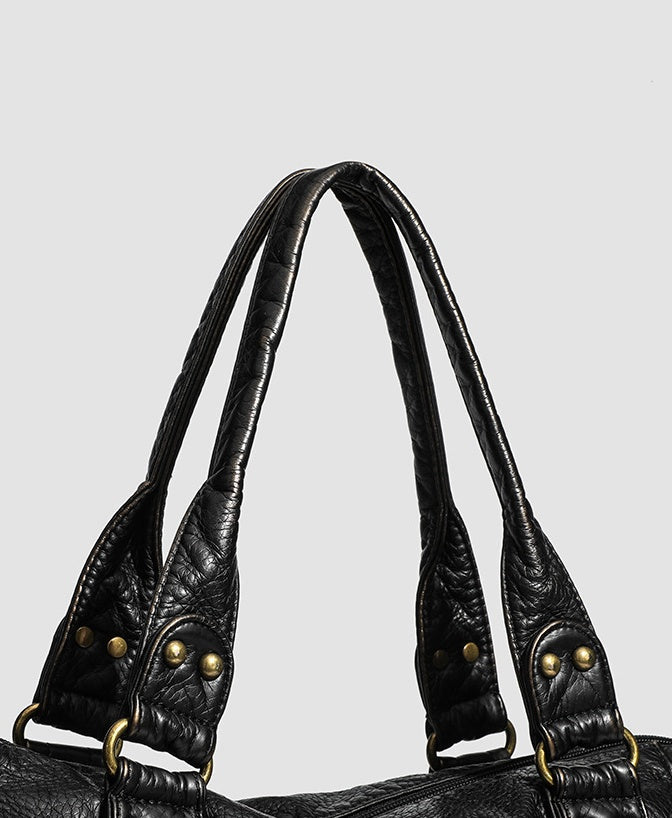 The Moonlit Bag, close-up of the braided handles and brass rivets